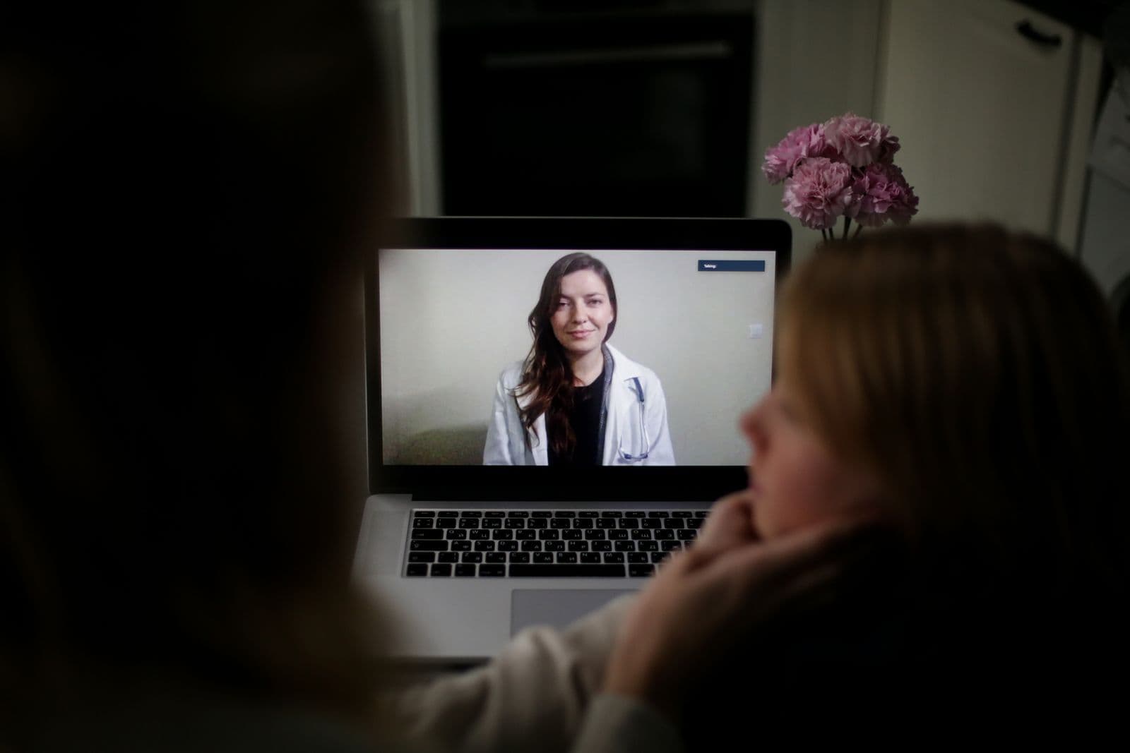 Healthcare professional using remote patient monitoring technology